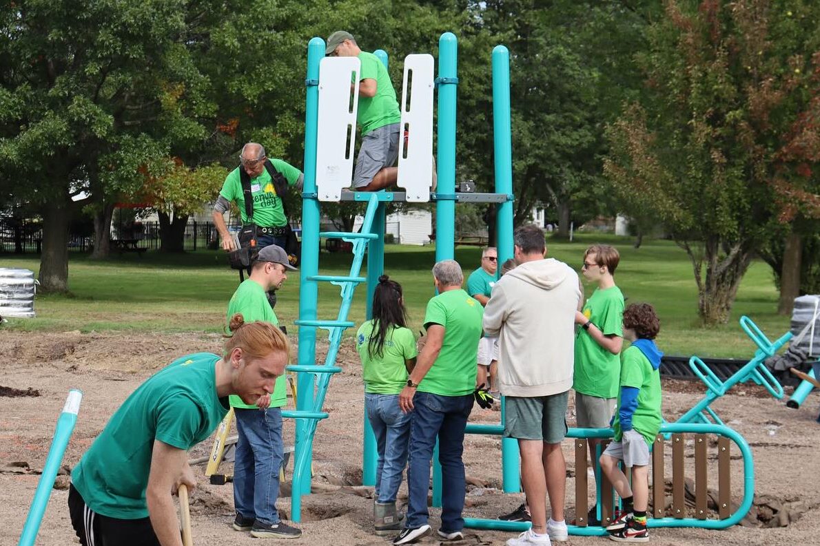 Group putting playground equipment together