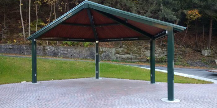 Photo of a large metal open air outdoor shelter.