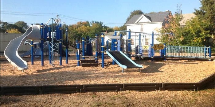 Photo of playground with slides and climbers.