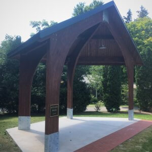 Photo of an open outdoor wood shelter