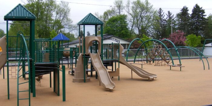 Photo of playground with climbers, slides, and tunnels.